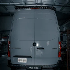 Mercedes Sprinter rear bumper installed on a 144 wheelbase high roof van, matte black powder coat finish, Rugged Design Concepts fabrication
