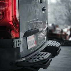 Rugged Design Concepts rear step rugged bumper side view on 2500 Mercedes Sprinter van, black powder coated aluminum, tail light clearance fit, van build accessory