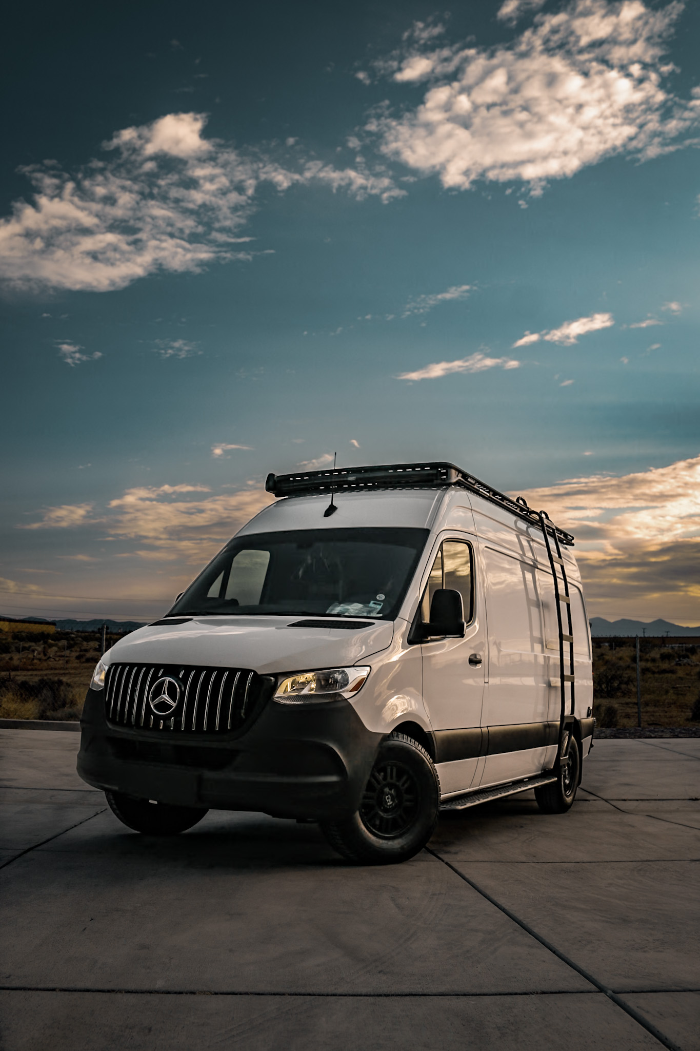 Rugged CLB Roof Rack 144 Wheelbase Mercedes Sprinter Van with a Rugged Design Concepts Roof Rack, Baja LP Curved Light Bar Rack with Sprinter Side Ladder and Sprinter Side Steps